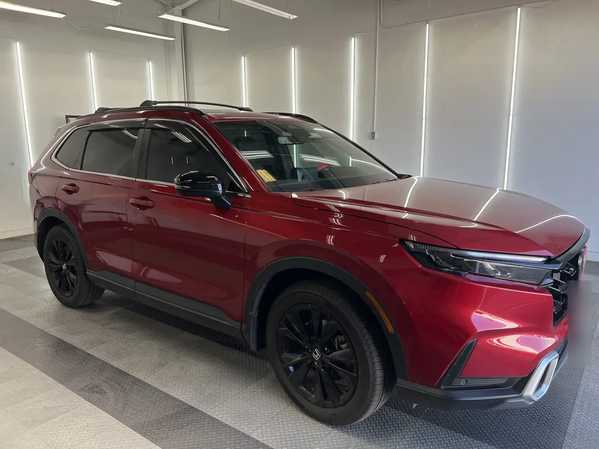 Red Honda CR-V after Avery Dennison Encore Supreme ceramic window tint (view 1)