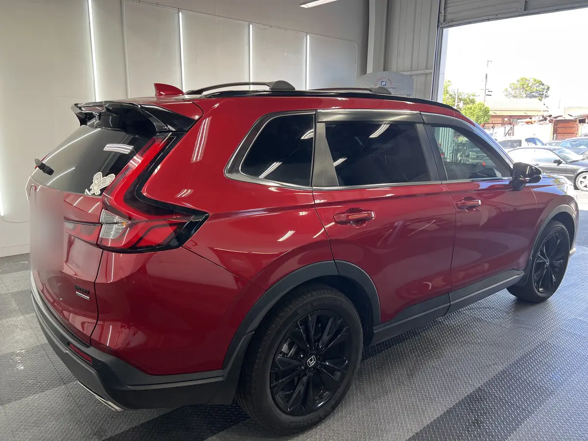 Red Honda CR-V after Avery Dennison Encore Supreme ceramic window tint (view 3)