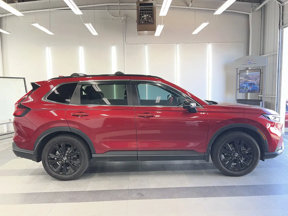 Red Honda CR-V before window tinting, factory glass (view 1)