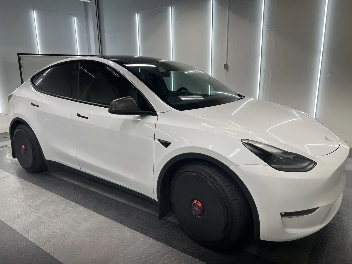 White Tesla Model Y after Avery Dennison Encore Supreme ceramic window tint (view 1)