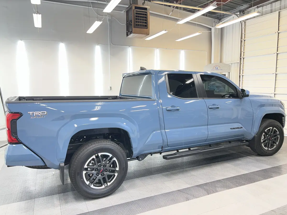 Blue Toyota Tacoma after Avery Dennison Encore Supreme ceramic window tint (view 1)