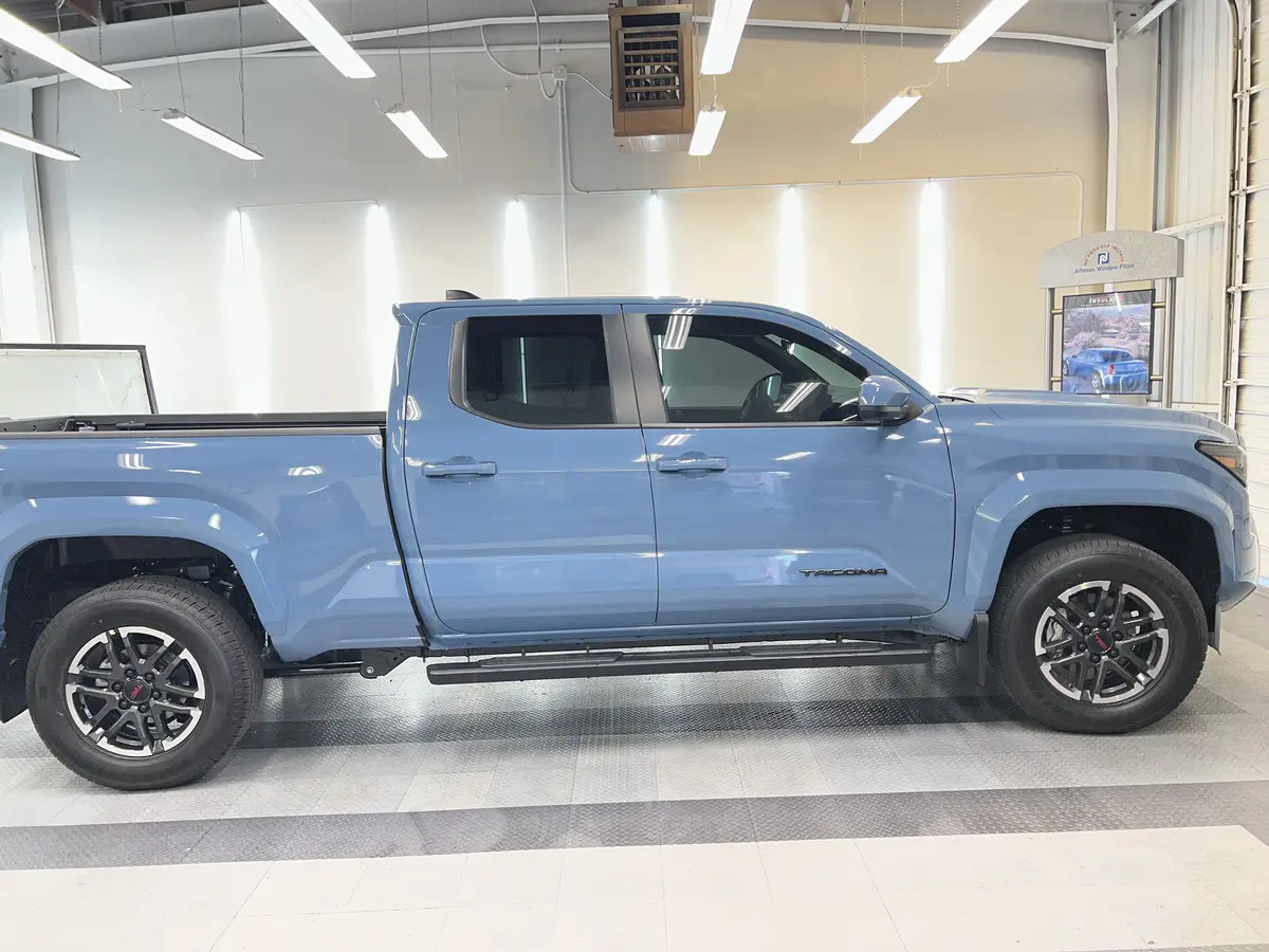 Blue Toyota Tacoma after Avery Dennison Encore Supreme ceramic window tint (view 2)