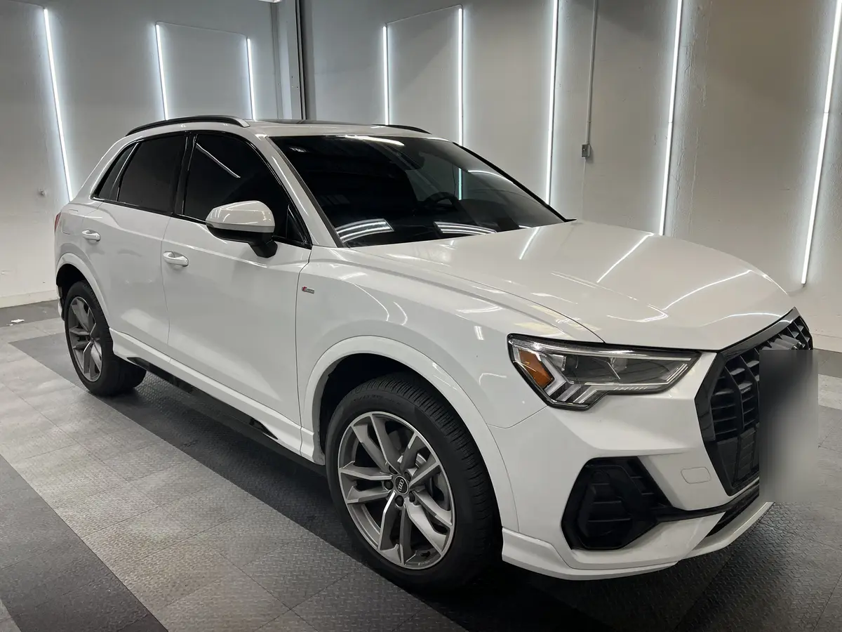 White Audi Q3 after Avery Dennison Encore Supreme ceramic window tint (view 1)
