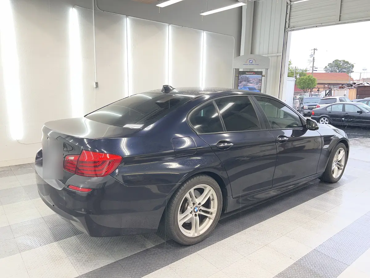 Blue BMW 5 Series after Avery Dennison Encore Supreme ceramic window tint (view 2)