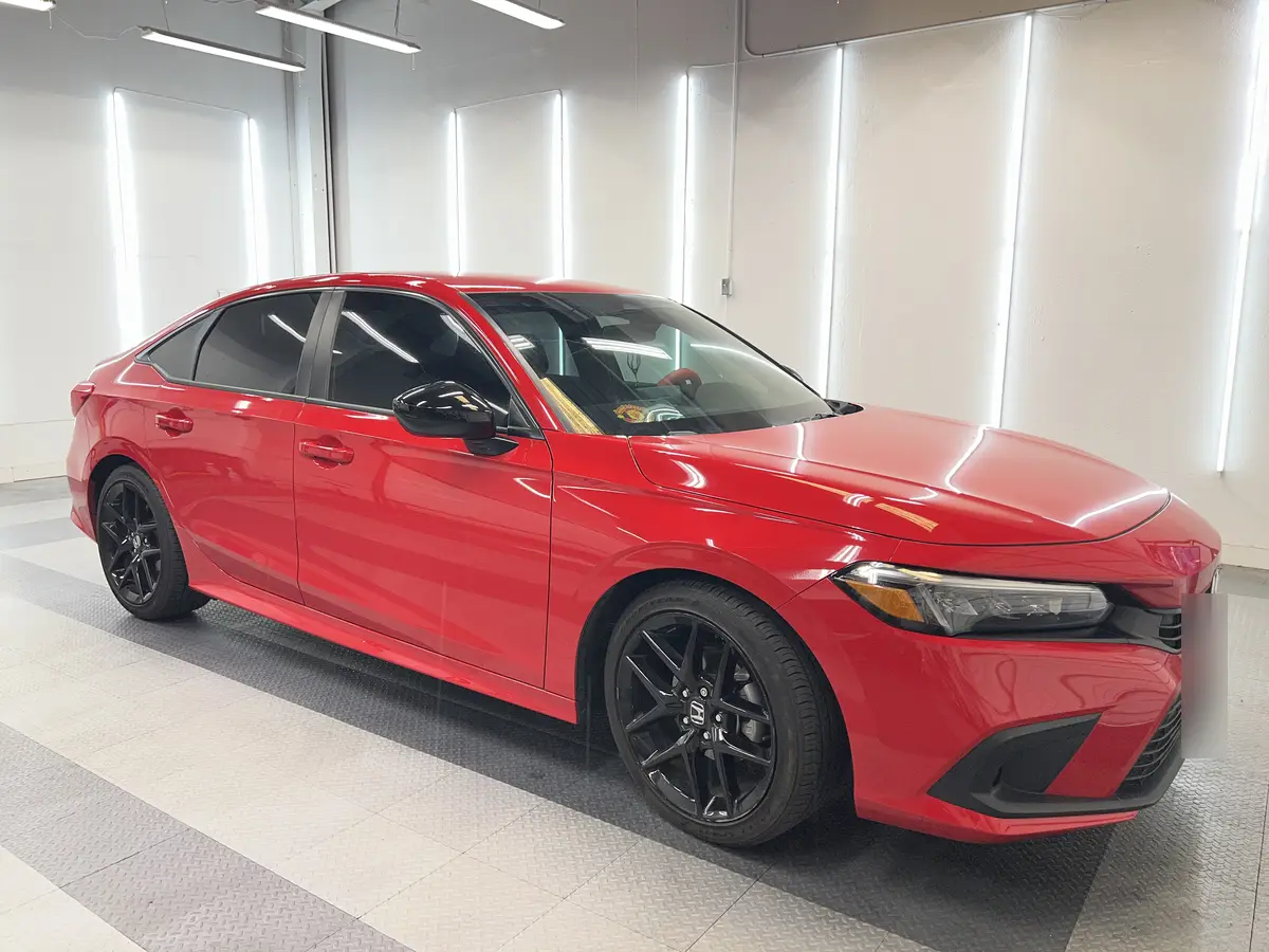Red Honda Civic after Avery Dennison Encore Supreme ceramic window tint (view 1)