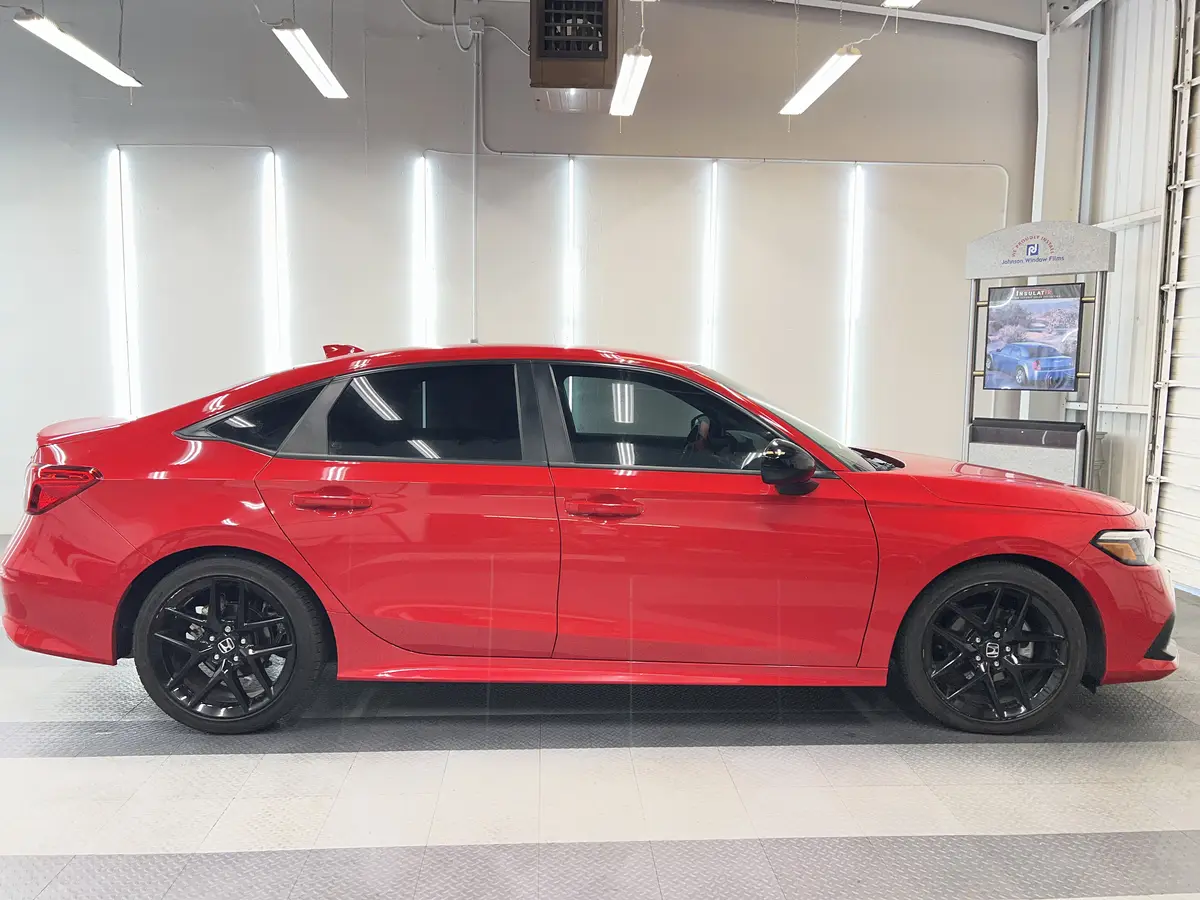 Red Honda Civic after Avery Dennison Encore Supreme ceramic window tint (view 2)