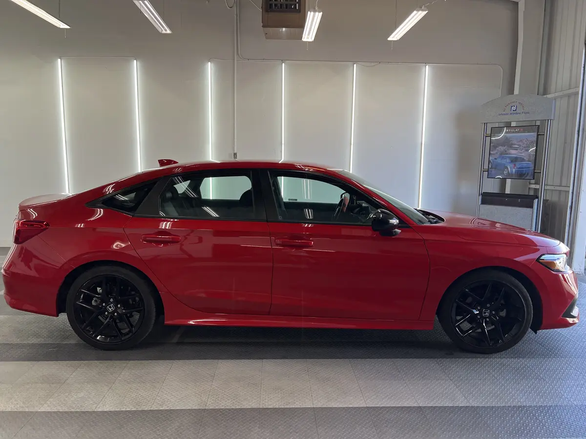 Red Honda Civic before window tinting, factory glass (view 2)