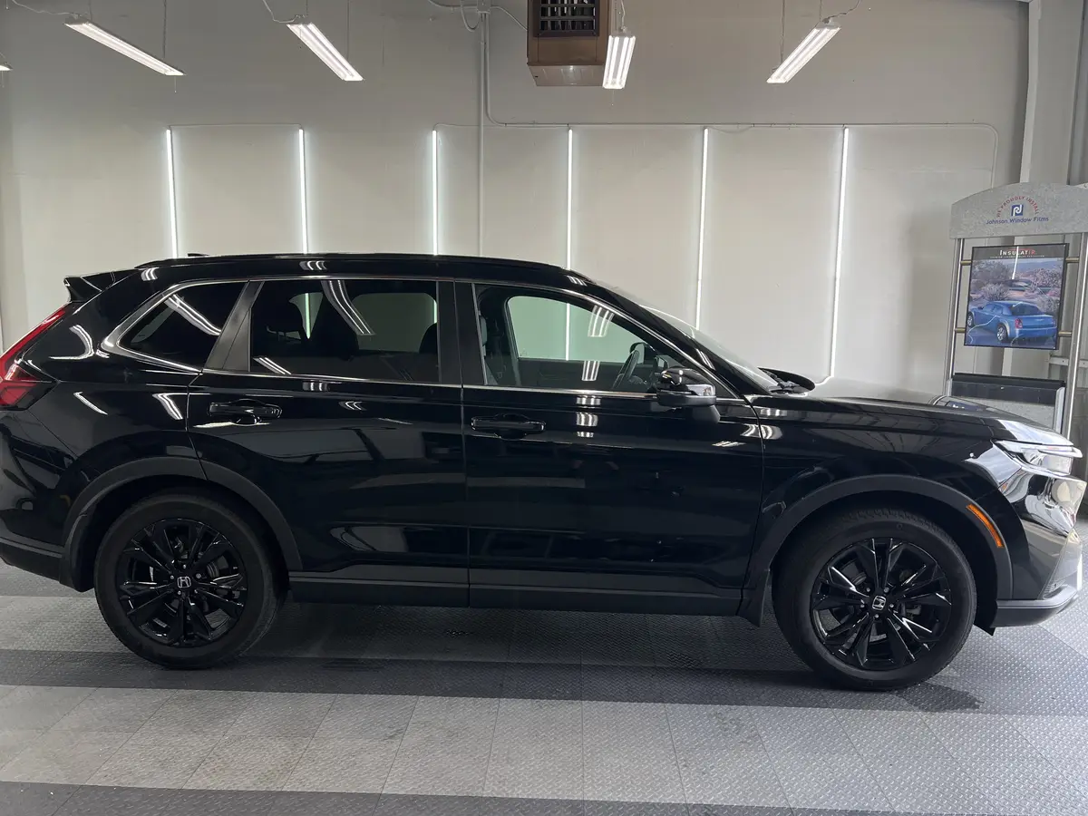 Black Honda CR-V before window tinting, factory glass (view 1)