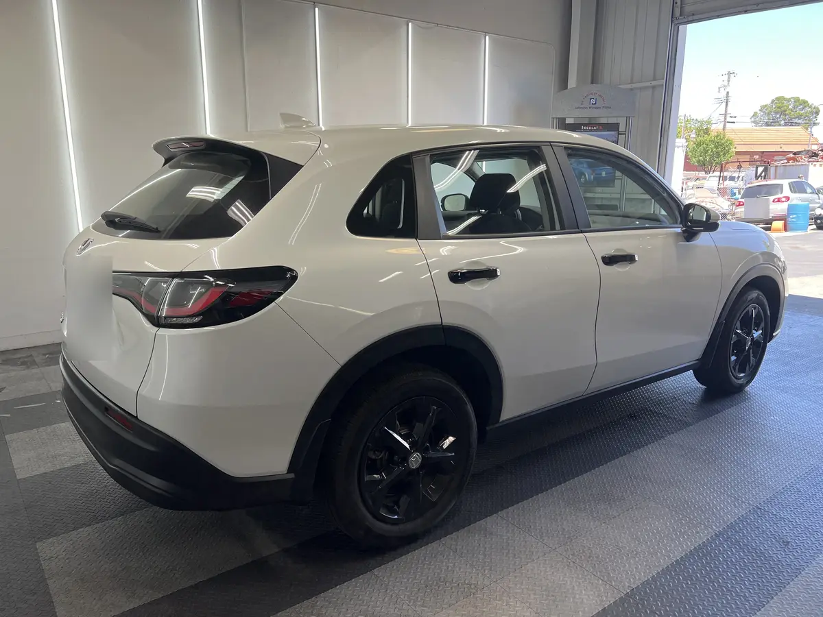 White Honda HR-V before window tinting, factory glass (view 1)