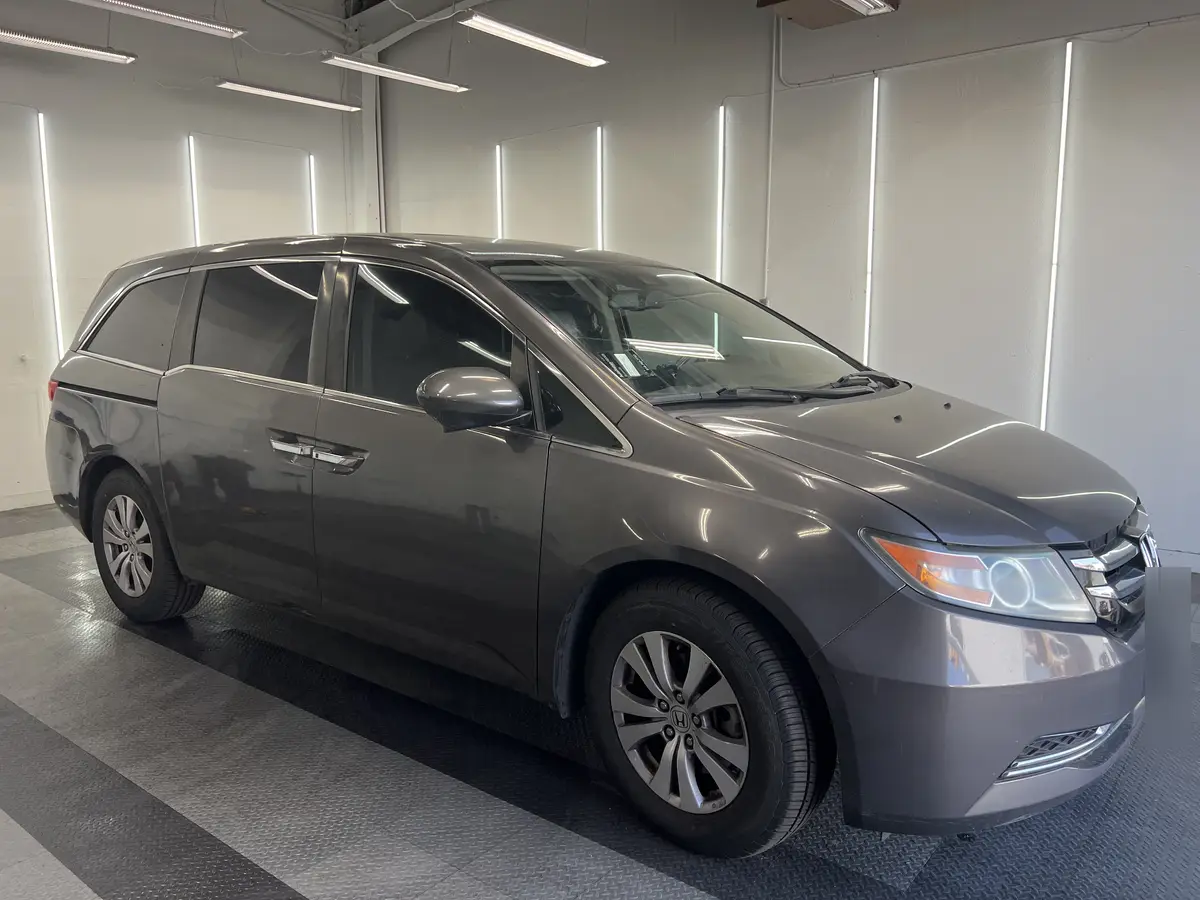 Gray Honda Odyssey after Avery Dennison Encore carbon window tint (view 1)