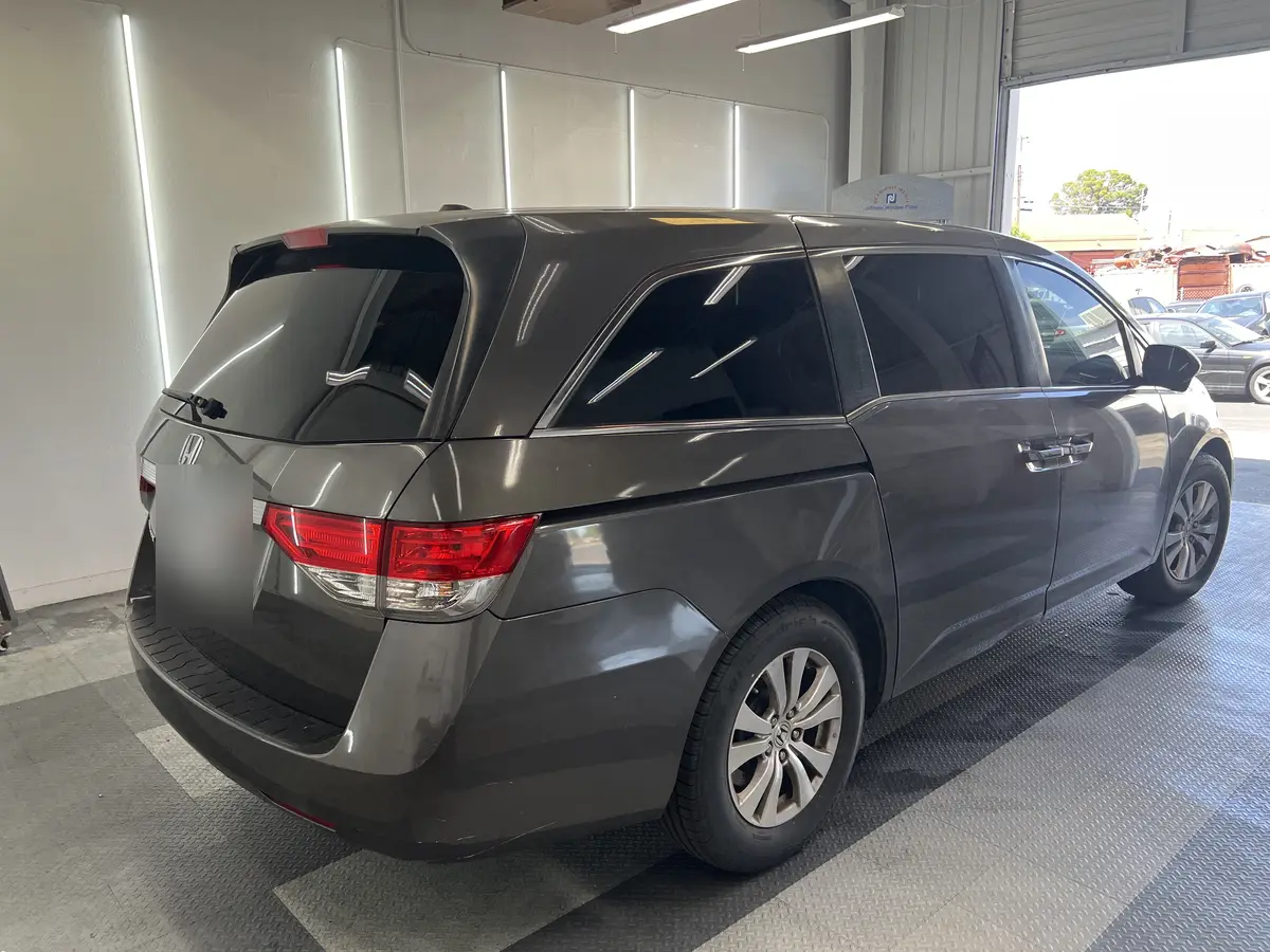 Gray Honda Odyssey after Avery Dennison Encore carbon window tint (view 3)