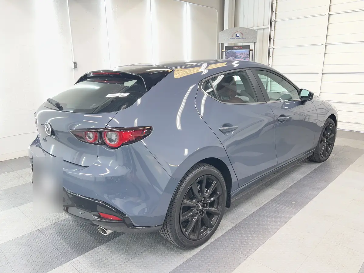 Gray Mazda Mazda3 before window tinting, factory glass (view 1)