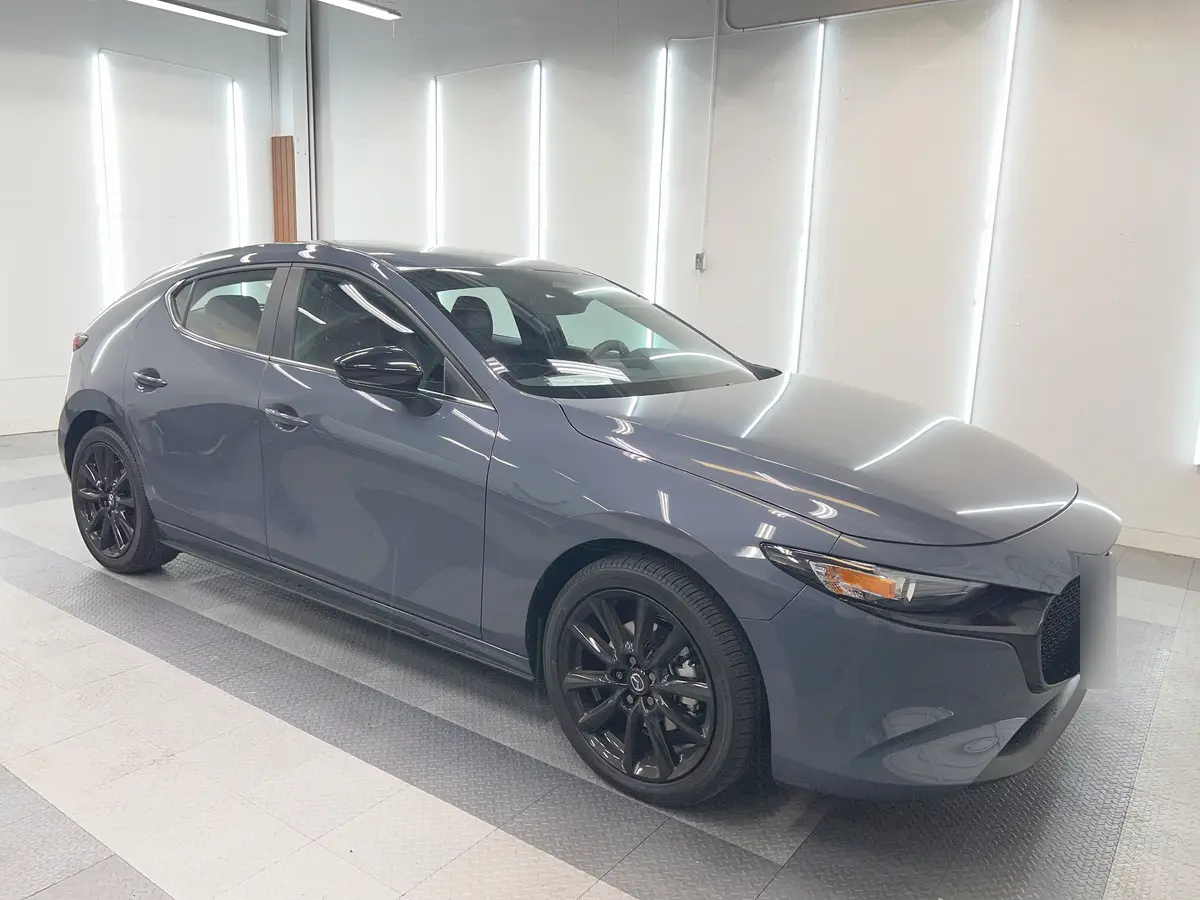 Gray Mazda Mazda3 before window tinting, factory glass (view 3)