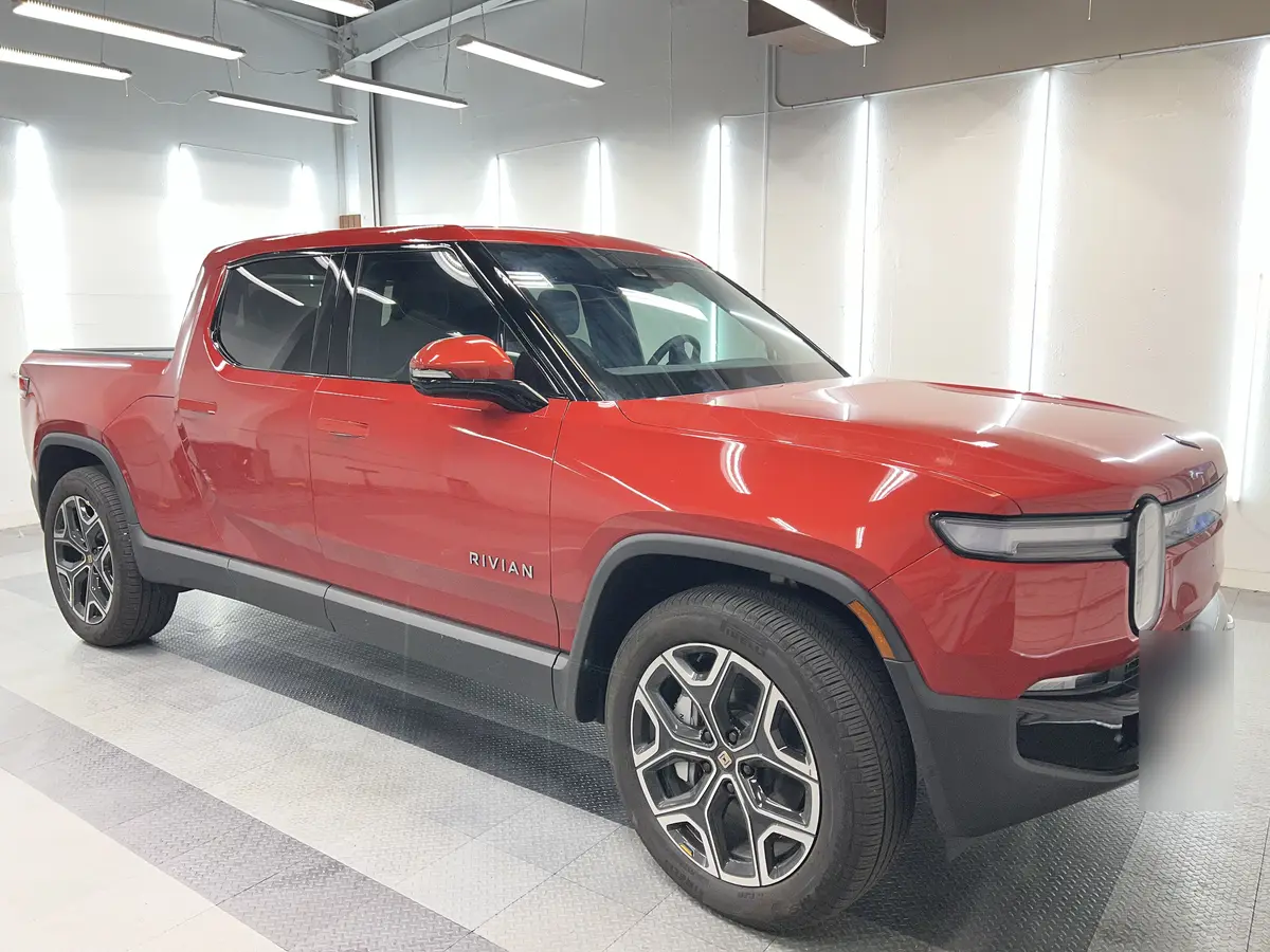Red Rivian R1T after Avery Dennison Encore Supreme ceramic window tint (view 1)