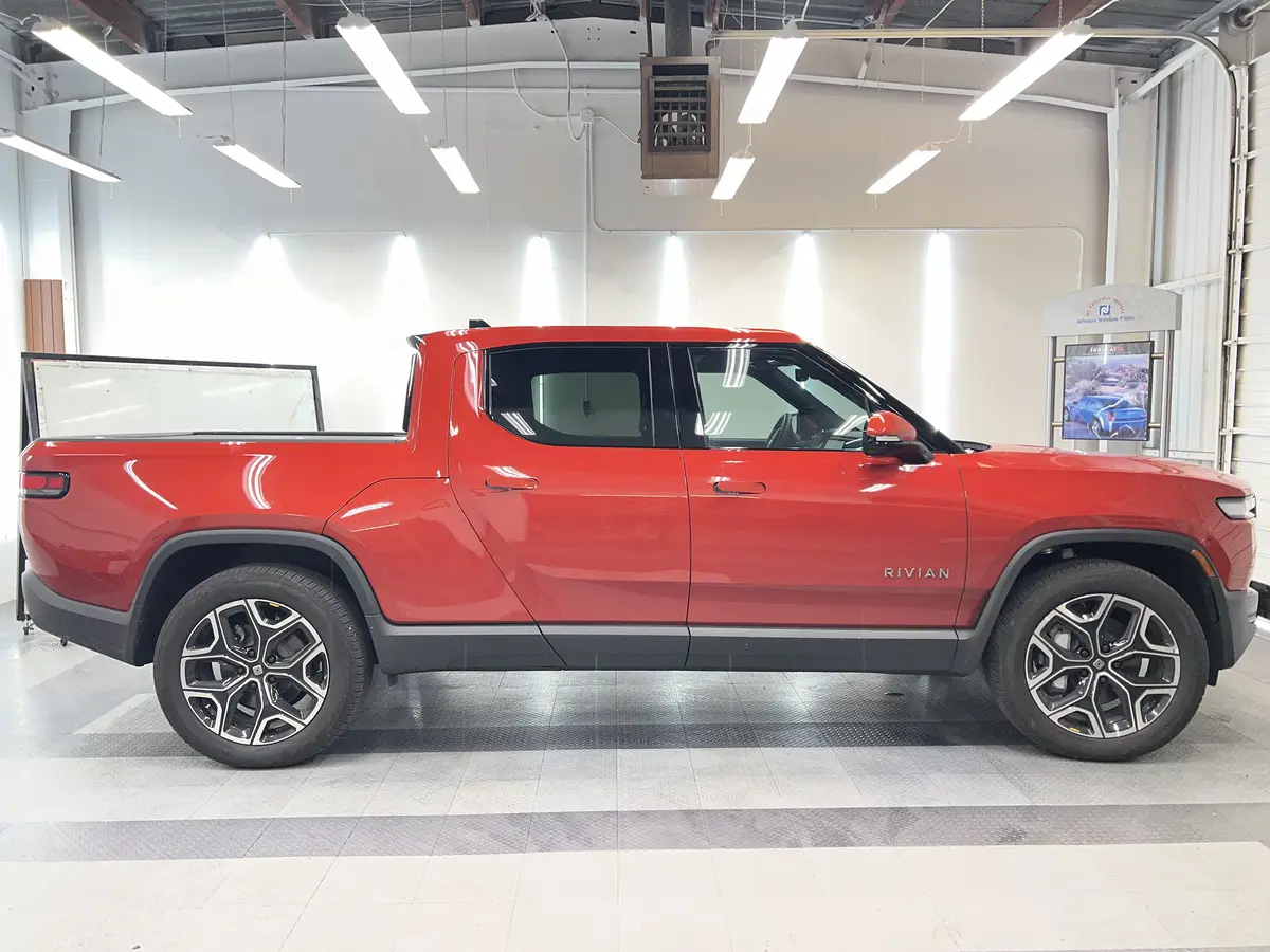 Red Rivian R1T after Avery Dennison Encore Supreme ceramic window tint (view 2)