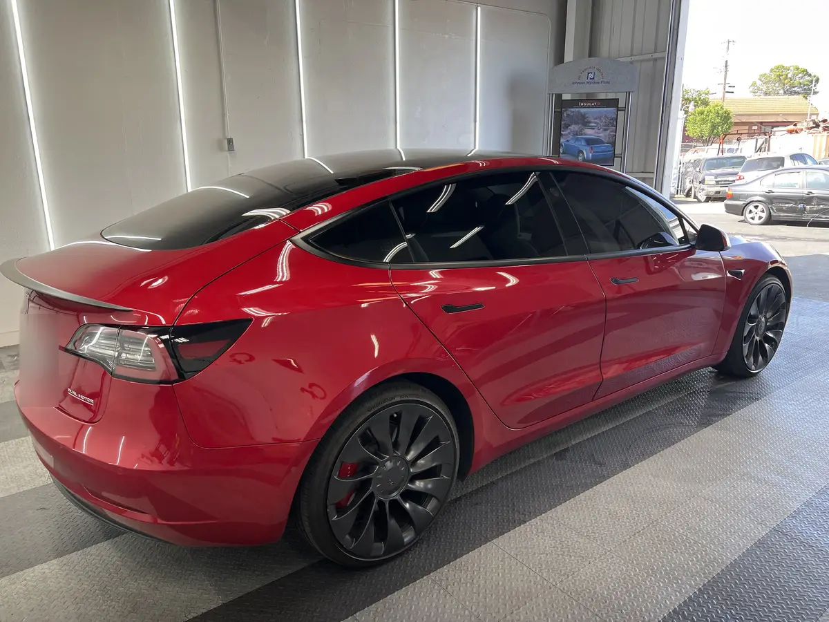 Red Tesla Model 3 after Avery Dennison Encore Supreme ceramic window tint (view 1)