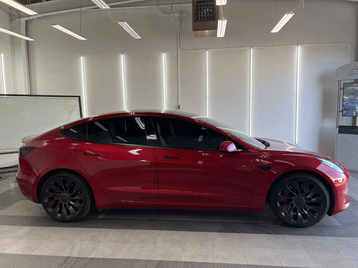 Red Tesla Model 3 after Avery Dennison Encore Supreme ceramic window tint (view 2)