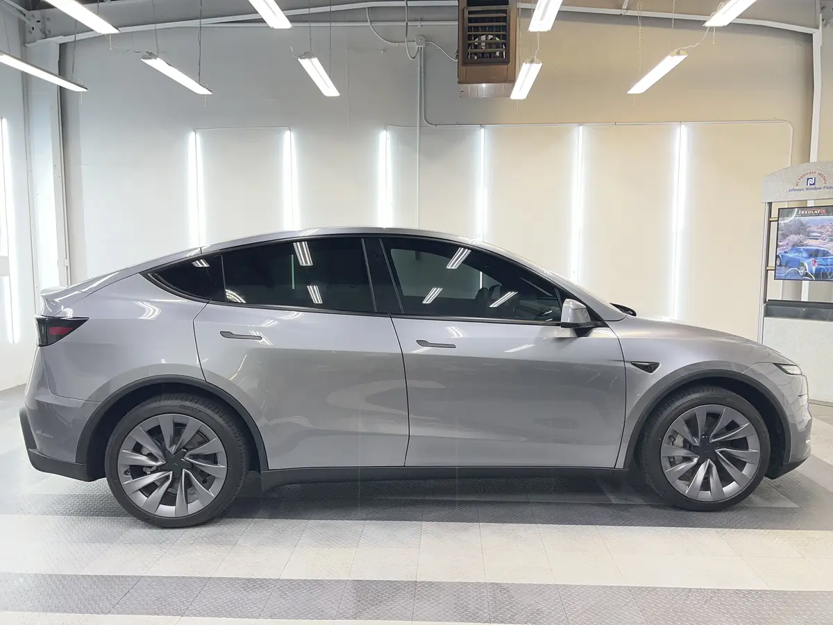 Gray Tesla Model Y after Avery Dennison Encore Supreme ceramic window tint (view 2)