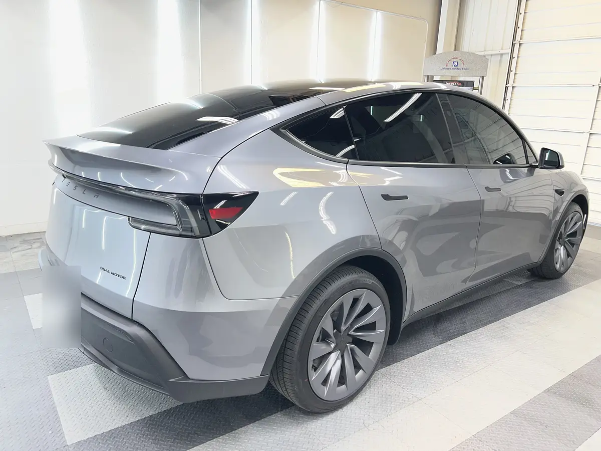 Gray Tesla Model Y after Avery Dennison Encore Supreme ceramic window tint (view 3)
