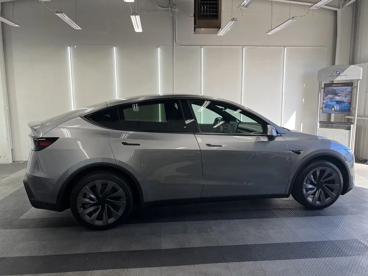 Gray Tesla Model Y before window tinting, factory glass (view 2)