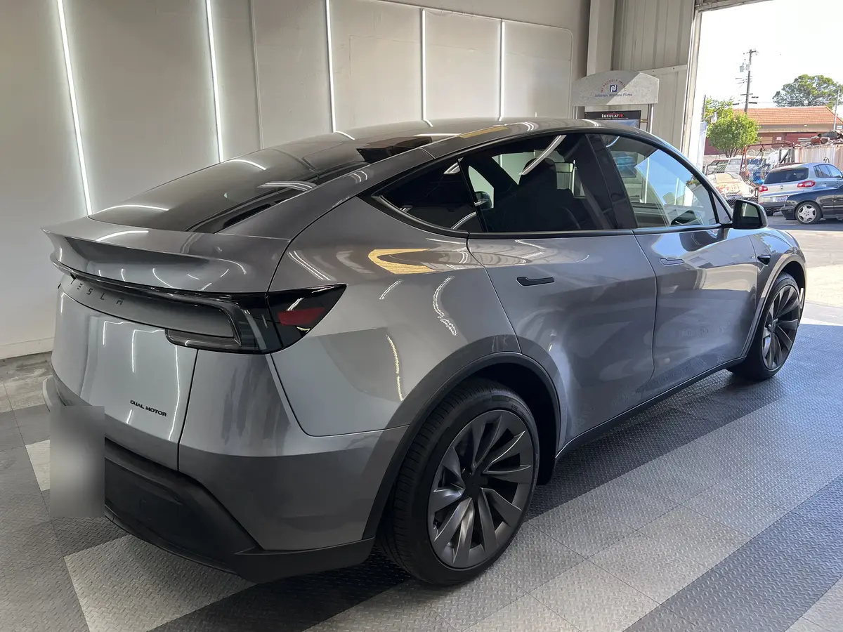 Gray Tesla Model Y before window tinting, factory glass (view 3)