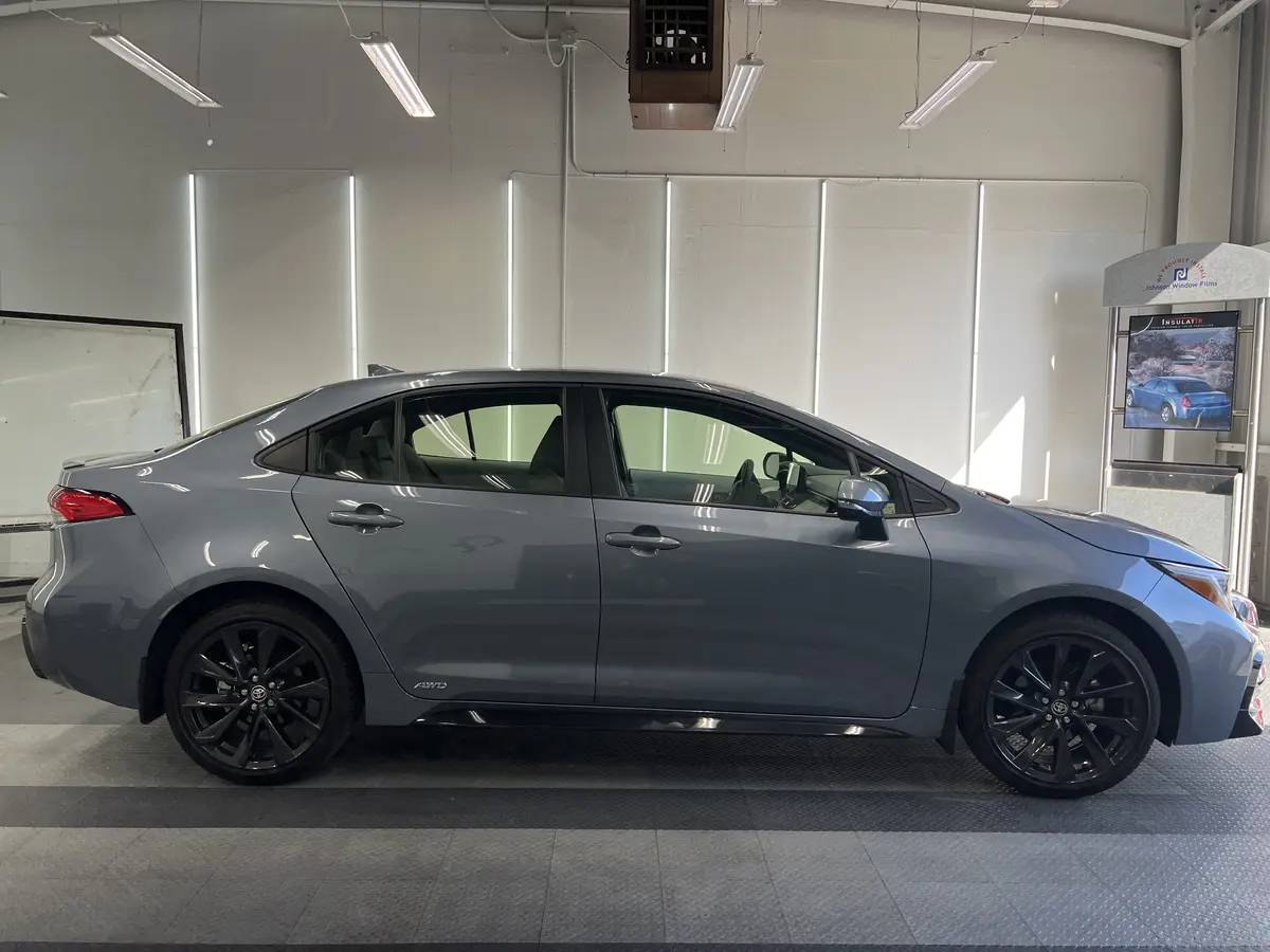 Gray Toyota Corolla before window tinting, factory glass (view 2)