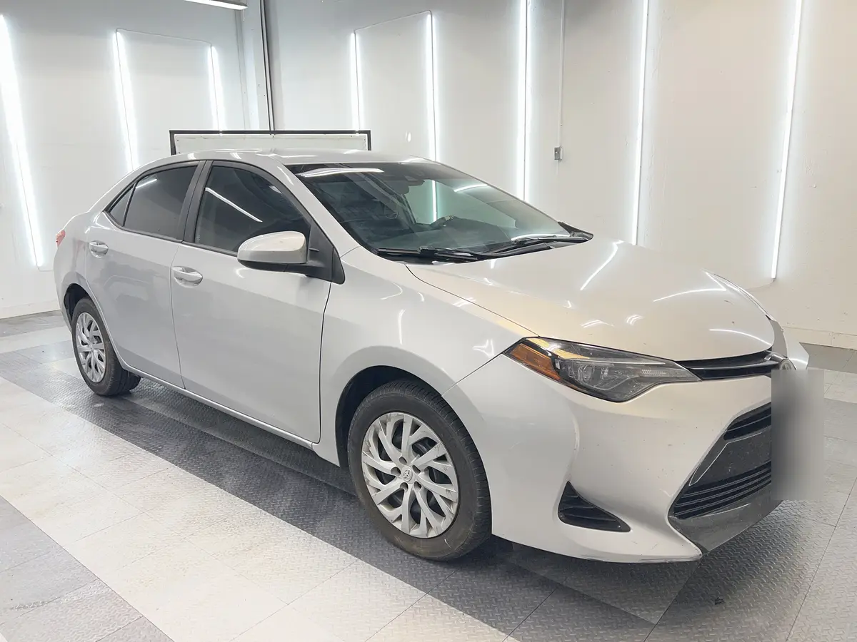 Silver Toyota Corolla after Avery Dennison Encore Supreme ceramic window tint (view 1)