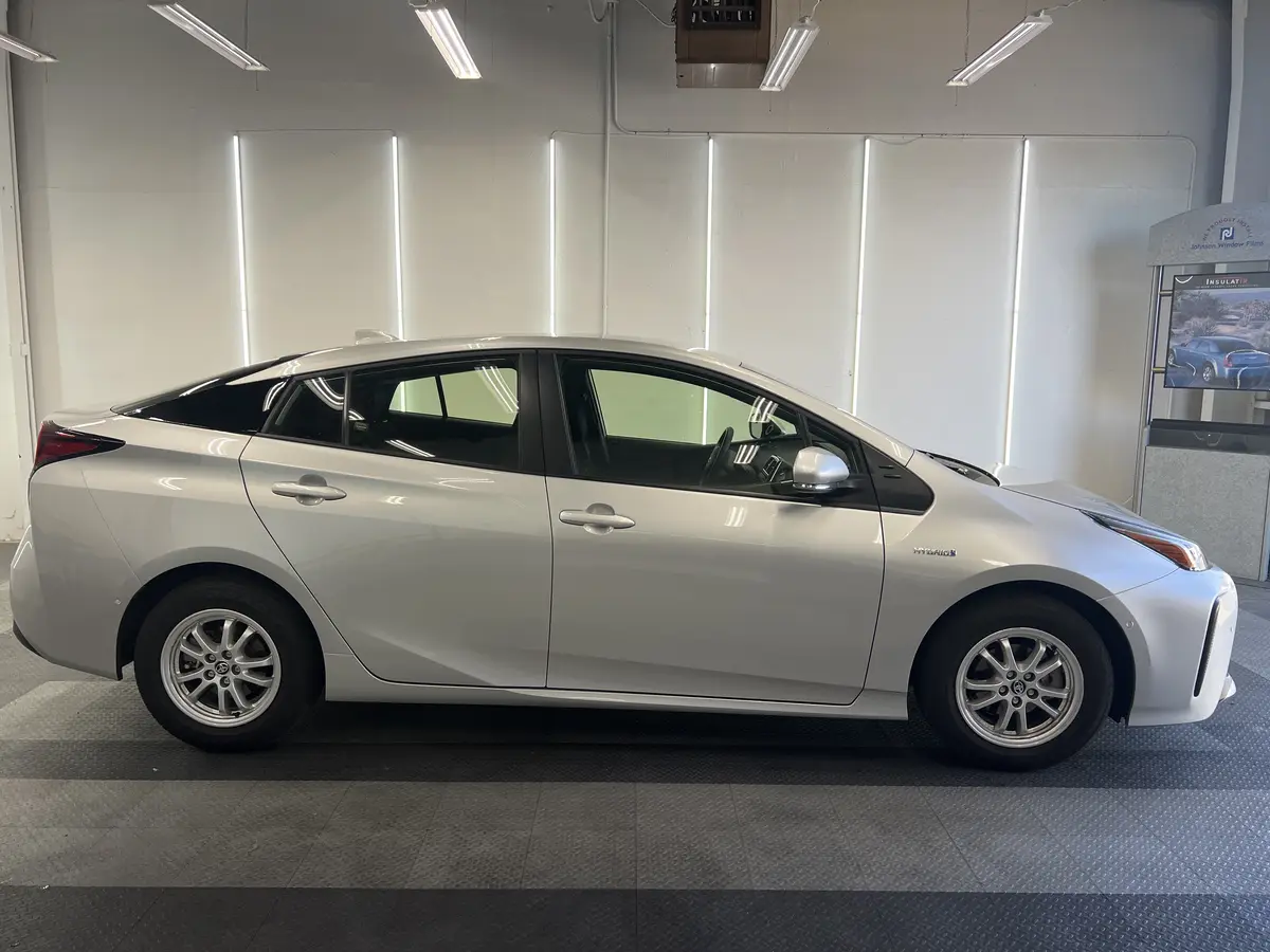 Silver Toyota Prius before window tinting, factory glass (view 1)