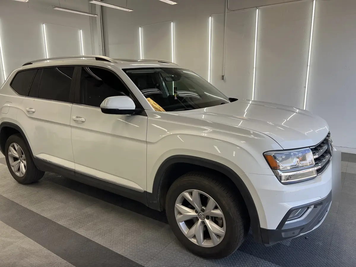 White Volkswagen Atlas before window tinting, factory glass (view 1)