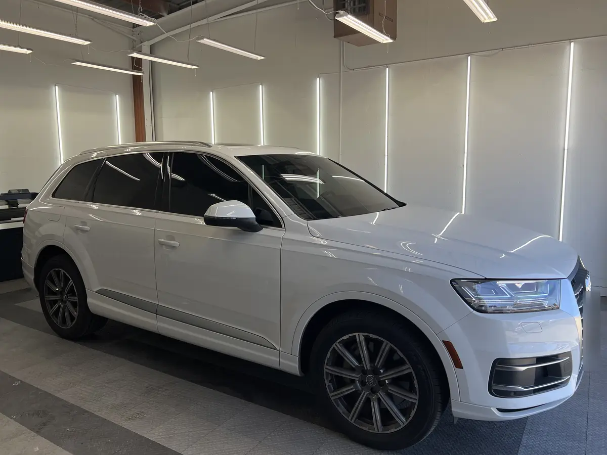 White Audi Q7 after Avery Dennison Encore Supreme ceramic window tint (view 1)