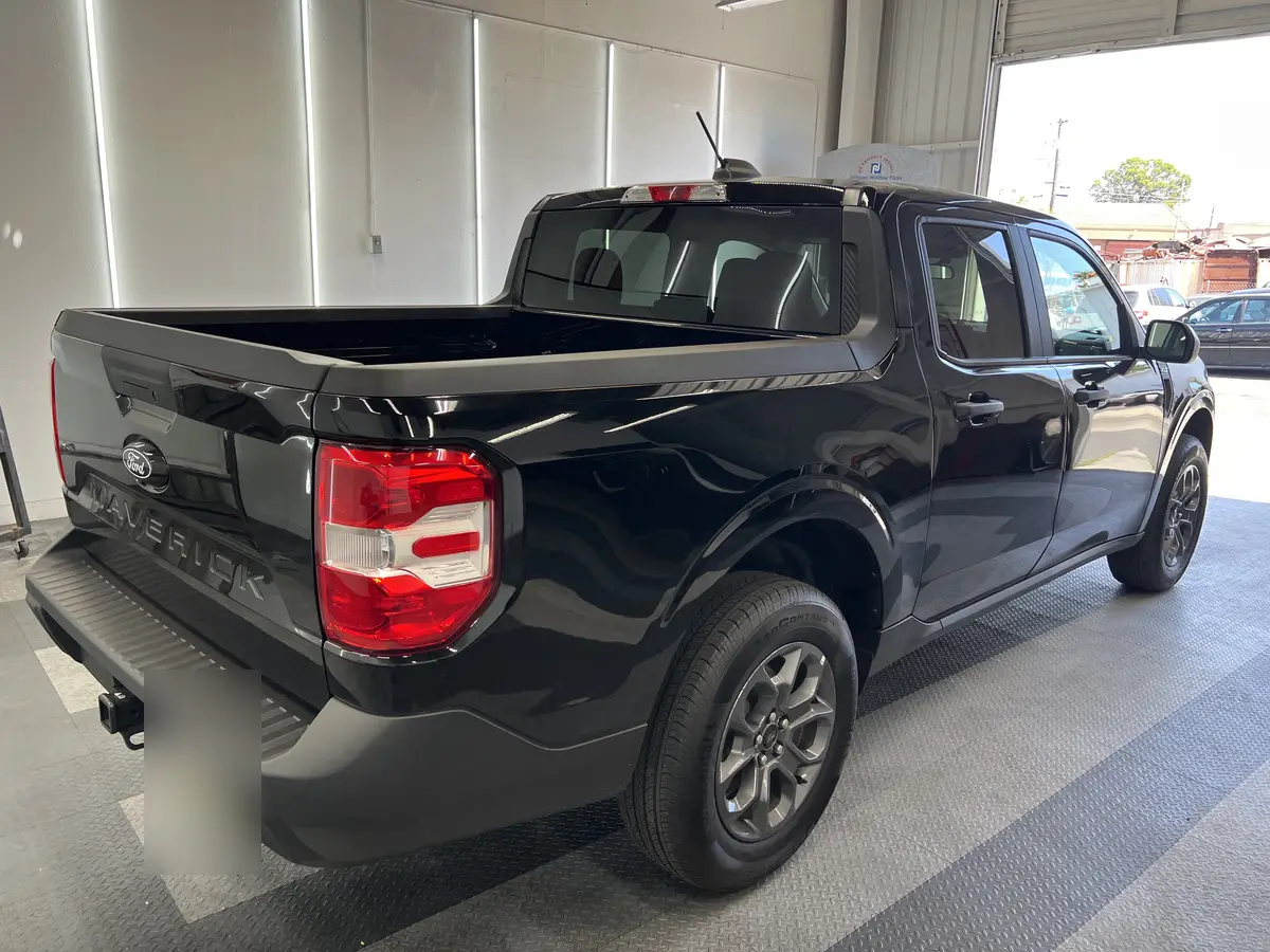 Black Ford Maverick before window tinting, factory glass (view 3)
