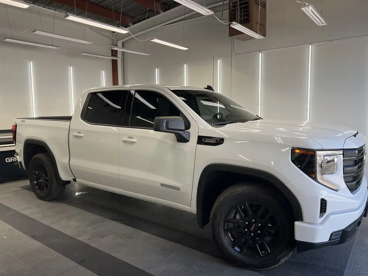 White GMC Sierra 1500 after Avery Dennison Encore Supreme ceramic window tint (view 1)