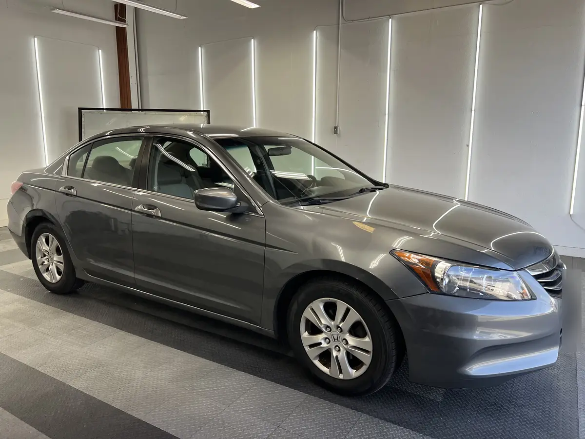 Gray Honda Accord before window tinting, factory glass (view 1)