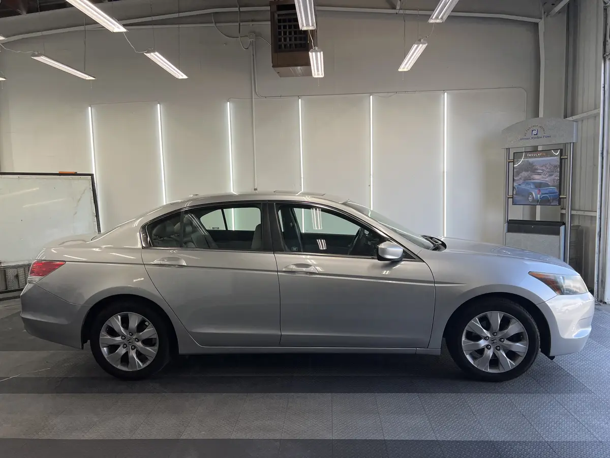 Silver Honda Accord before window tinting, factory glass (view 2)