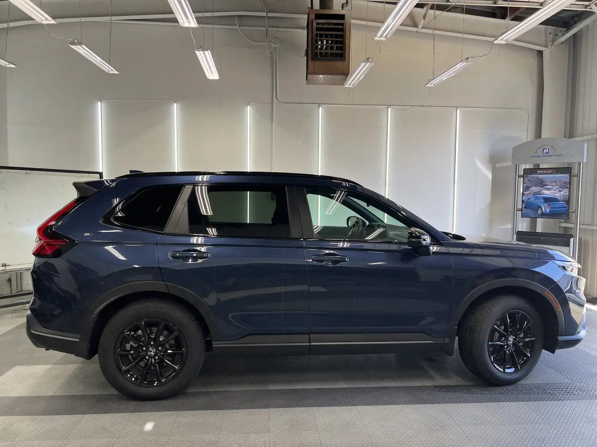 Blue Honda CR-V before window tinting, factory glass (view 2)