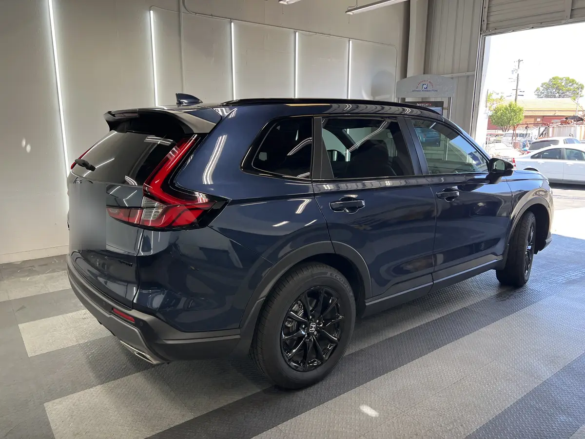 Blue Honda CR-V before window tinting, factory glass (view 3)
