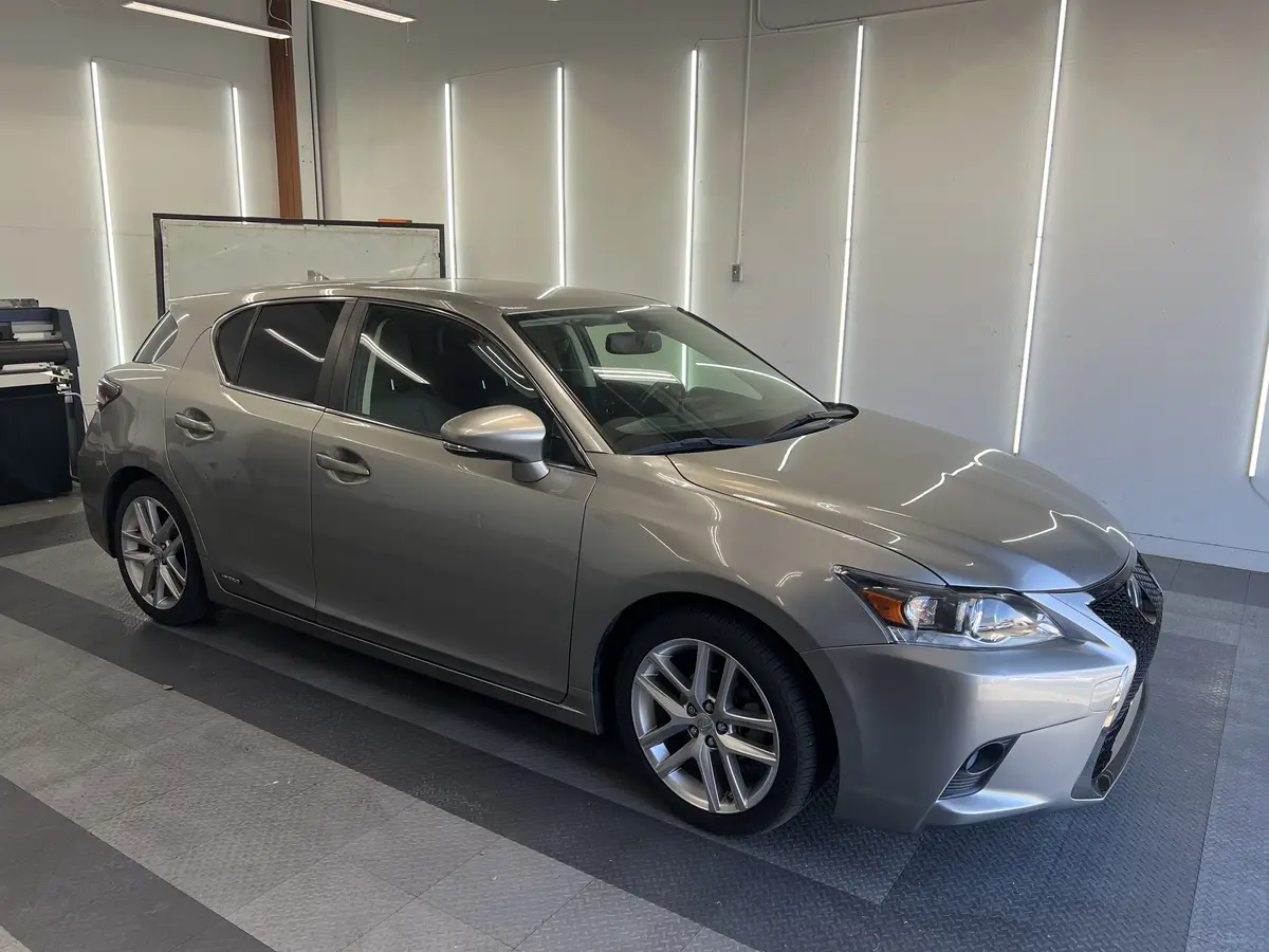 Silver Lexus CT 200h before window tinting, factory glass (view 1)
