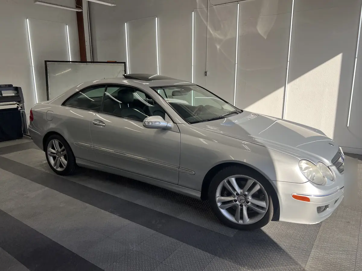 Silver Mercedes-Benz CLK before window tinting, factory glass (view 1)