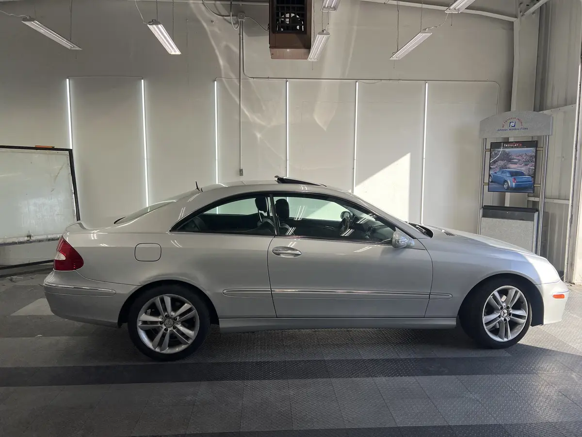 Silver Mercedes-Benz CLK before window tinting, factory glass (view 2)