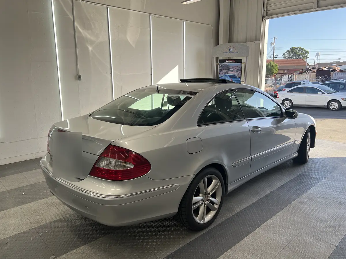 Silver Mercedes-Benz CLK before window tinting, factory glass (view 3)