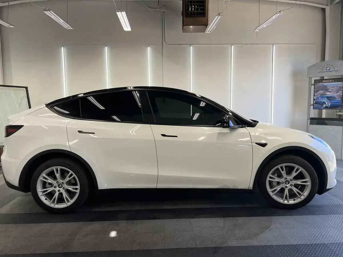 White Tesla Model Y after Avery Dennison Encore Supreme ceramic window tint (view 2)