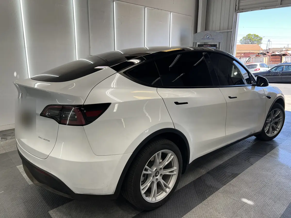 White Tesla Model Y after Avery Dennison Encore Supreme ceramic window tint (view 3)