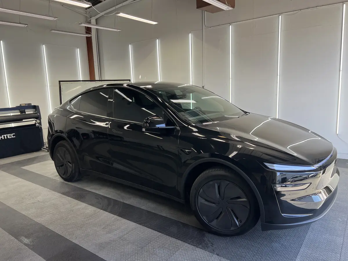Black Tesla Model Y after Avery Dennison Encore Supreme ceramic window tint (view 1)