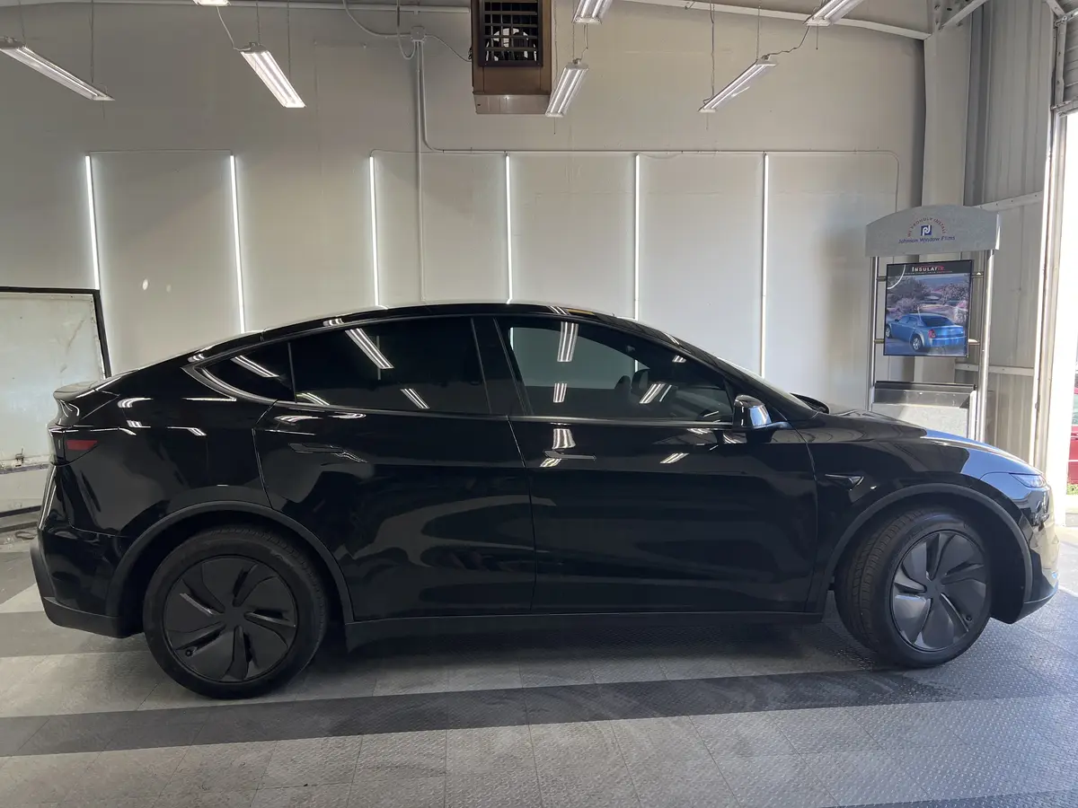 Black Tesla Model Y after Avery Dennison Encore Supreme ceramic window tint (view 2)