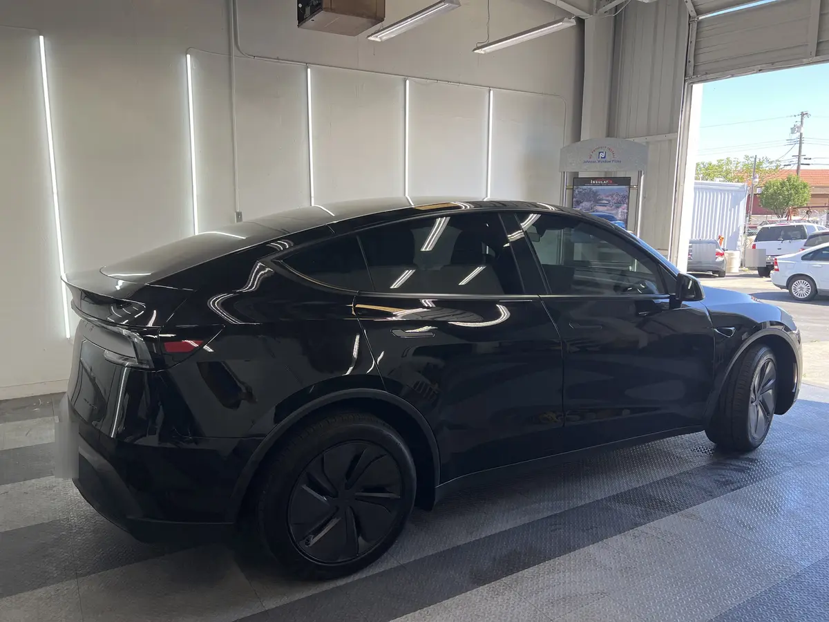 Black Tesla Model Y after Avery Dennison Encore Supreme ceramic window tint (view 3)
