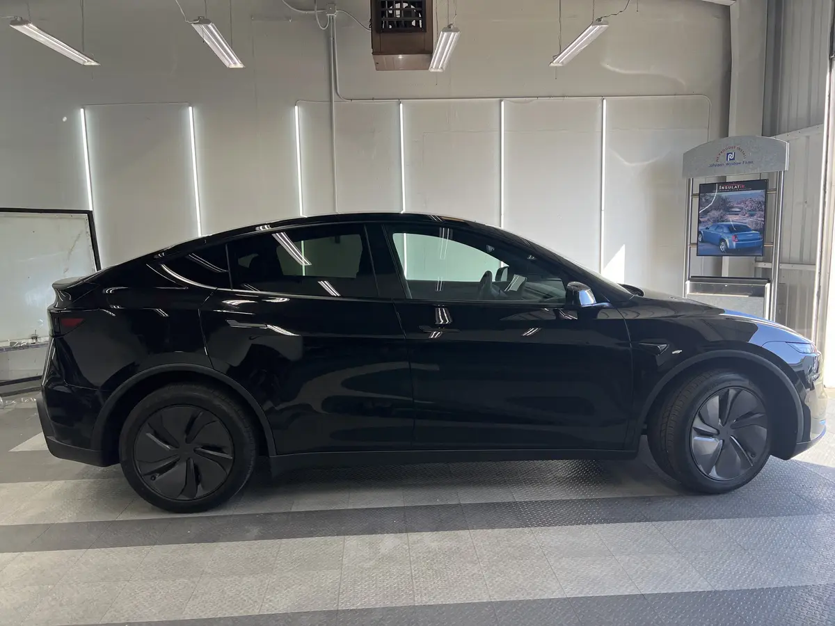 Black Tesla Model Y before window tinting, factory glass (view 2)