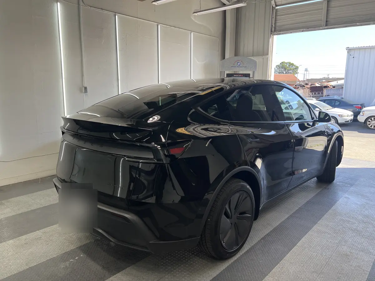 Black Tesla Model Y before window tinting, factory glass (view 3)