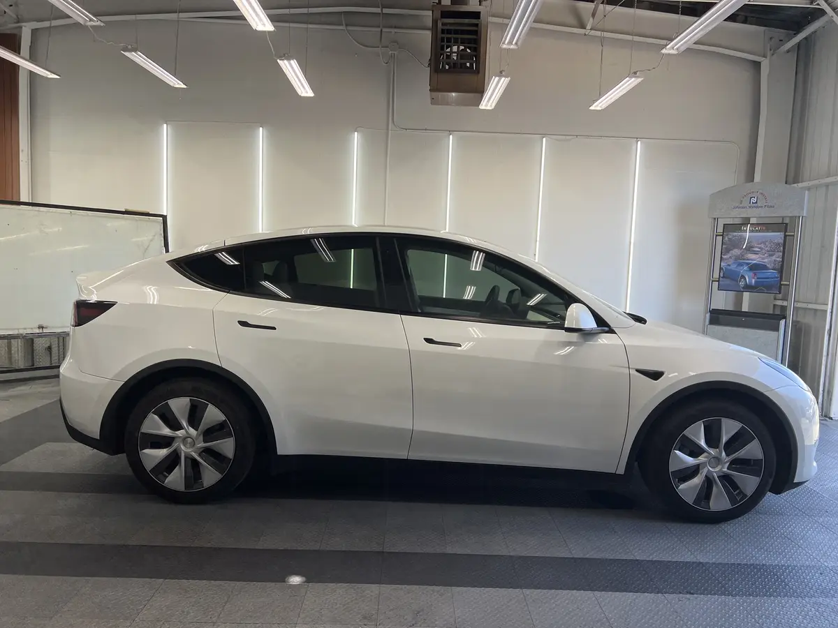 White Tesla Model Y after Avery Dennison Encore Supreme ceramic window tint (view 2)