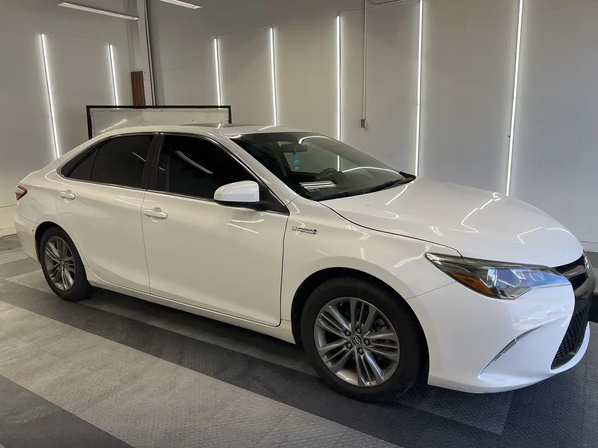 White Toyota Camry after Avery Dennison Encore carbon window tint (view 1)