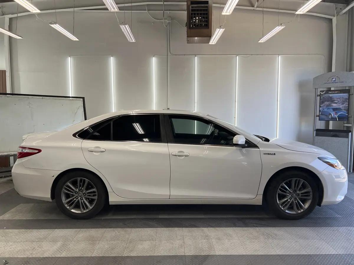 White Toyota Camry after Avery Dennison Encore carbon window tint (view 2)